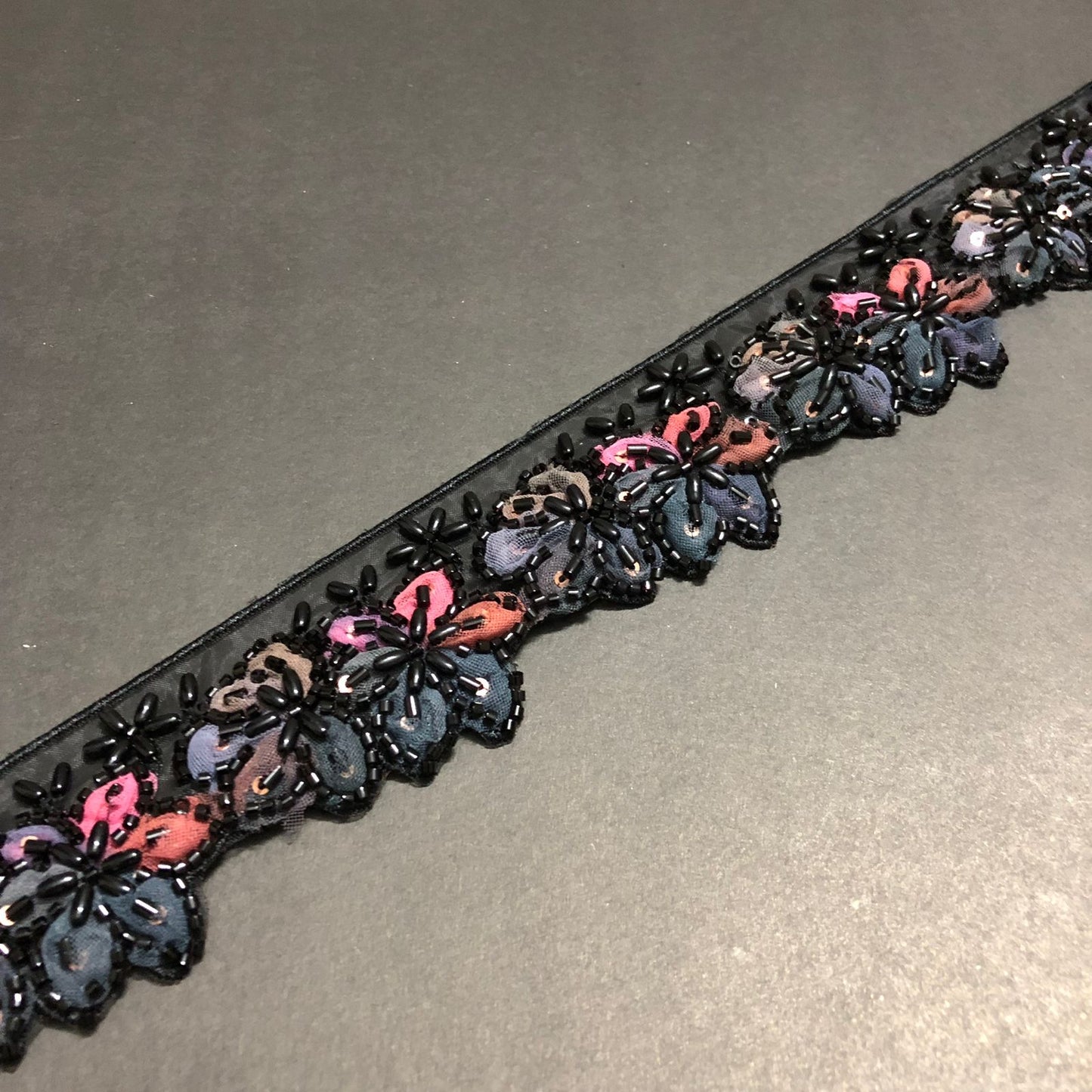 Cut-Edge Bloomy Black Cutdana, Black Beads, and Pink, Rust, Metallic Grey, and Light Brown Net Tissue Lace